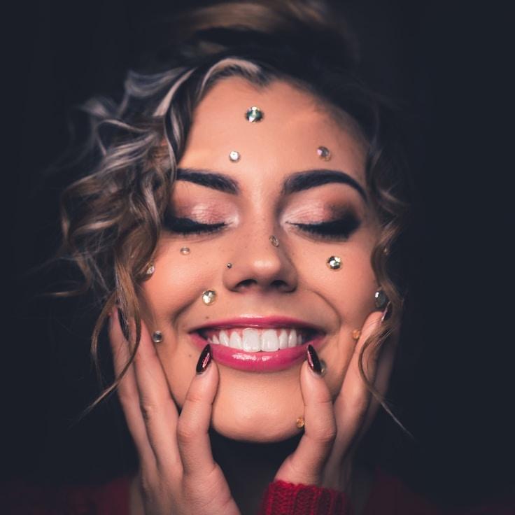 Kaveri Mehta, Lead Design Curator at PoliteDomainGentle, reviewing corporate floral arrangements